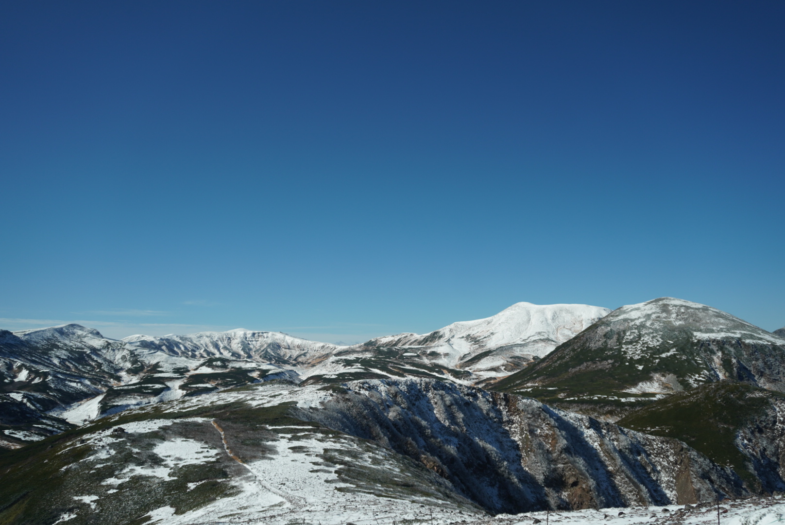Mt. Hokuchin is the snow covered peak on the right